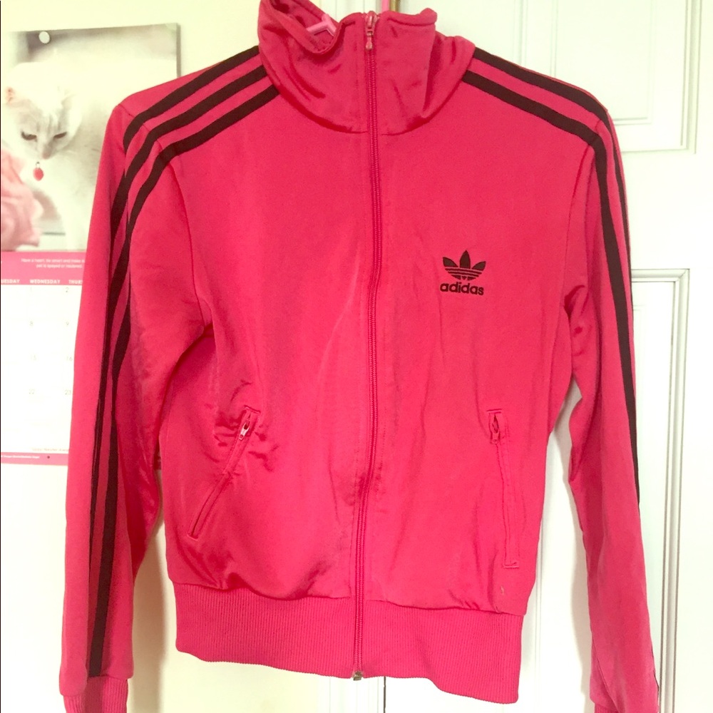 Pink Adidas tracksuit top.
